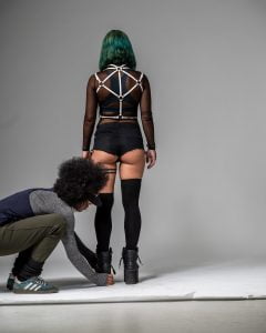 Camilla Wellton kneeling while styling a we got cookies model on a setheels